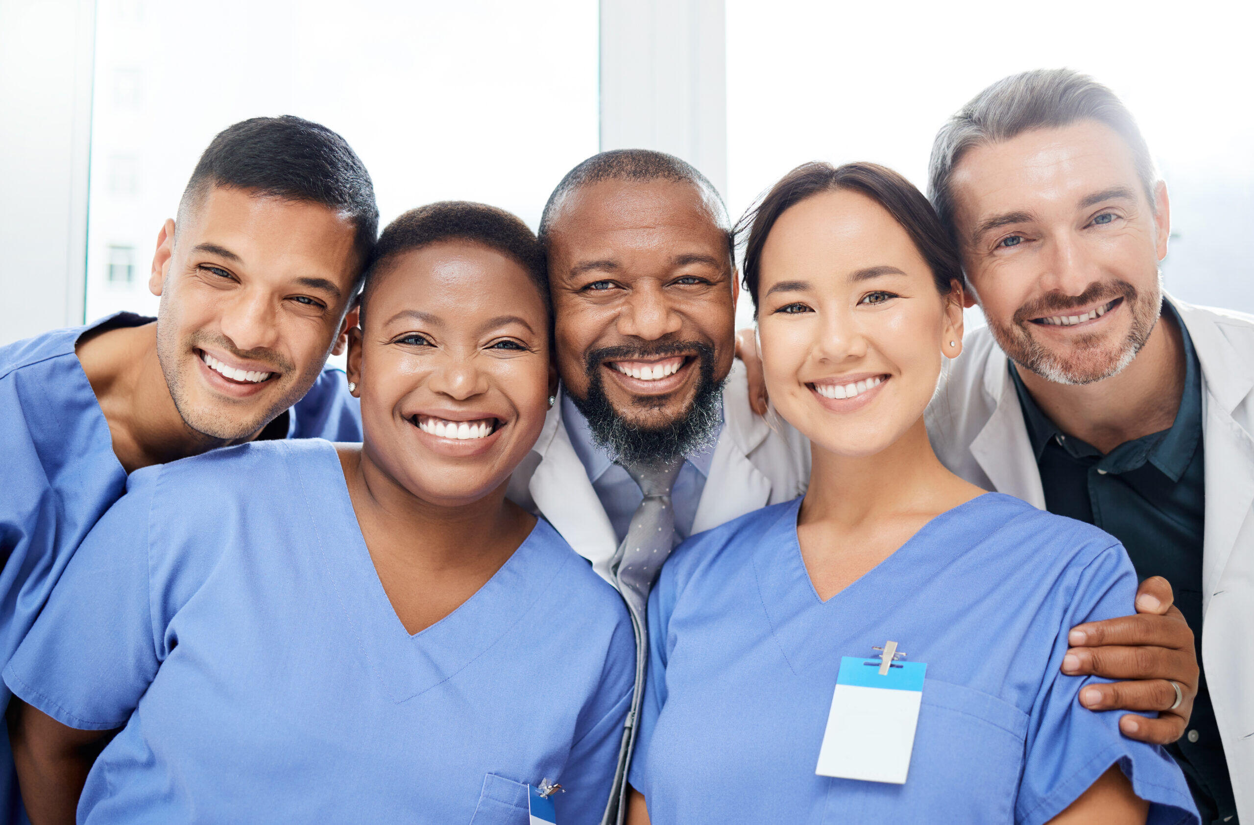 Diverse and happy marketing team smiling together