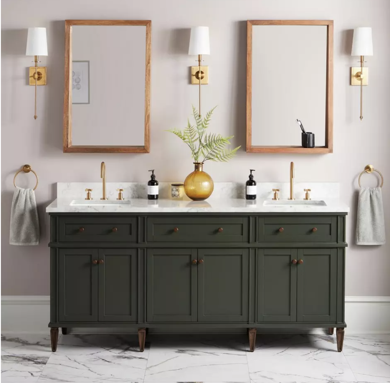 Luxury bathroom vanity with green wood cabinetry, white marble double sink countertop, and marble flooring
